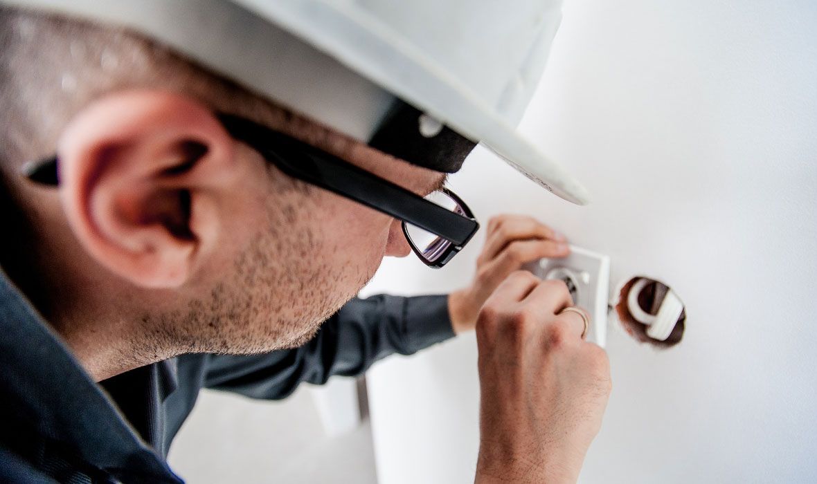 Electrician Repairing Wall Socket Electrician Repairing Wall Socket